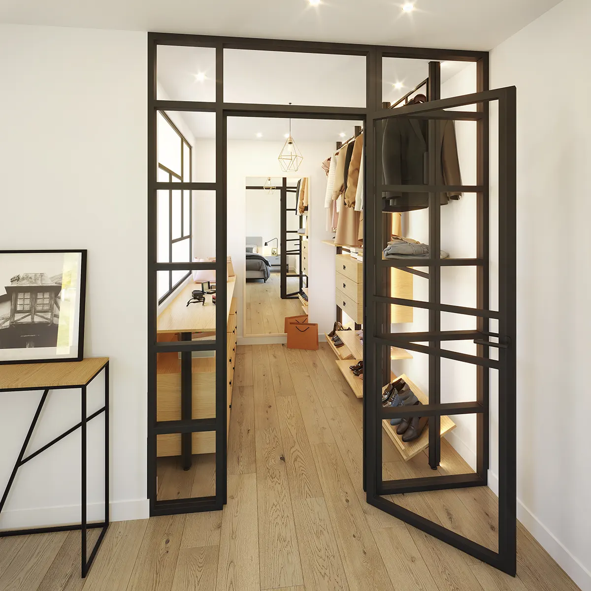 Amplia suite principal donde una gran mampara de aluminio negro separa la zona de descanso de un baño con cristal translúcido y un vestidor con cristal transparente.